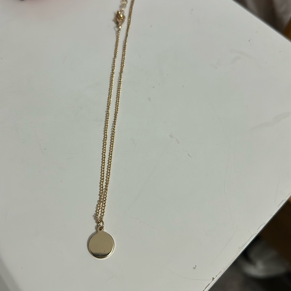 Classy gold necklace with circle charm